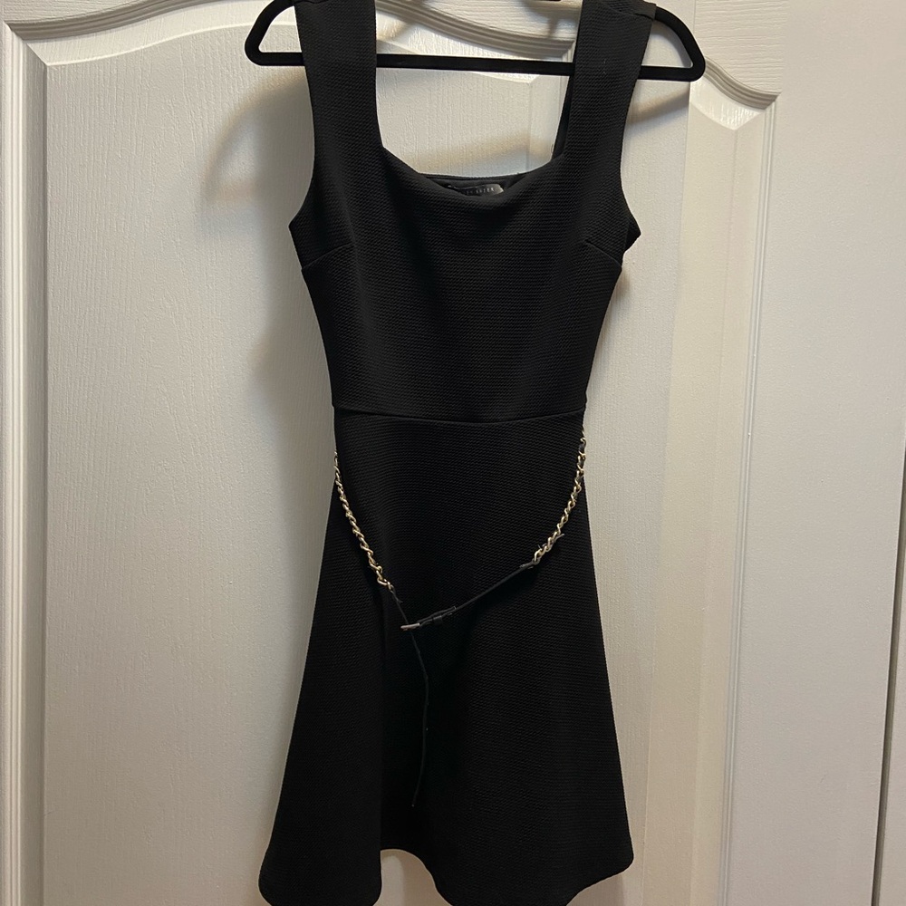 Elegant Black Dress with Chain Detail